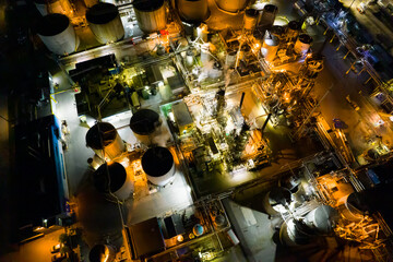 Industrial oil and gas manufacturing refinery factory at night, petrol crude and petrochemical...