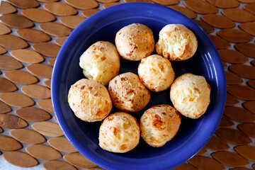 various cheese bread on a plate - Minas Gerais food
