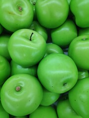 A bunch of fresh and healthy green apple fruits