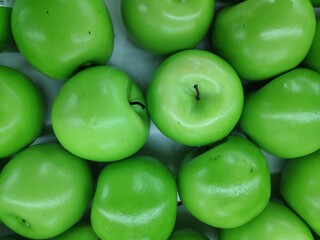 A bunch of fresh and healthy green apple fruits