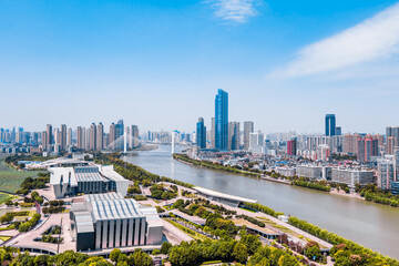 Fototapeta na wymiar Sunny day scenery of Qintai Grand Theater and Han River in Wuhan, Hubei, China
