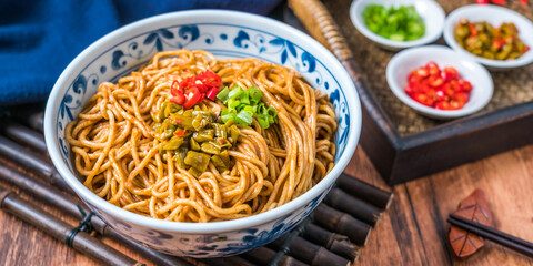 Wuhan gourmet hot dry noodles on wooden table
