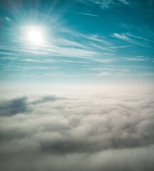 Naklejka na ściany i meble Aerial Shot above the clouds
