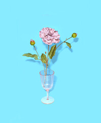 Pink flowers in cocktail glass. Creative still life, bright blue background. Summer light. 