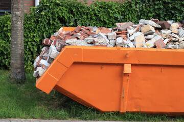 Bricks in a Garbage Dumpster - 516187298