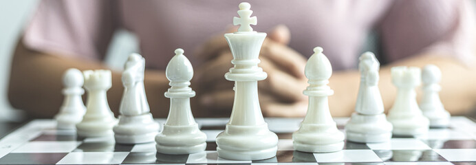 Businesswoman playing chess, Proactive business planning and marketing strategy just like playing chess, Business competition and success, Leadership concept.