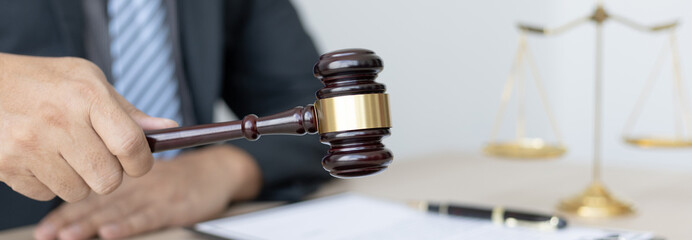 Lawyer or judge holding Hammer prepares to judge the case with justice, Legal consulting services and  litigation, scales of justice, law hammer, Concept of litigation and legal services