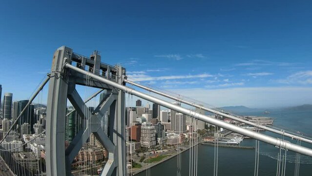 FPV drone shot over the Oakland bay bridge towards the city of San Francisco, USA - POV aerial