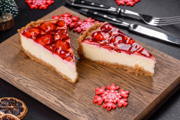 Delicious christmas strawberry tart on concrete background, top view, copy space