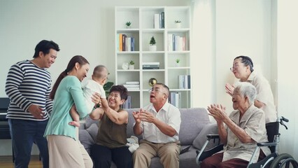 Happy Asian big family giving warm welcome with new member baby at home