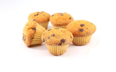 Group  of mini muffins with chocolate chip on white background.