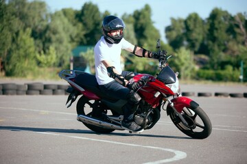 Obraz na płótnie Canvas Moto school track driving. A biker on a motorcycle. 