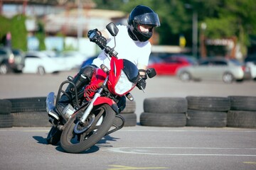 Moto school track driving. A biker on a motorcycle.
