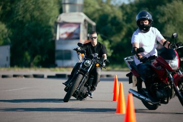 Moto school track driving. A biker on a motorcycle.
