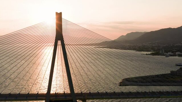 Drone shot of Rio - Antirrio bridge pylon at sunrise early morning, Peloponnese Greece.
