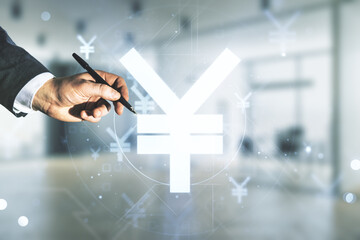 Male hand with pen working with abstract virtual Japanese Yen symbol sketch on blurred office background, strategy and forecast concept. Multiexposure
