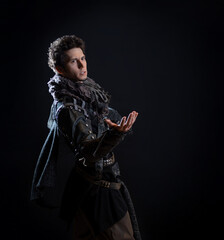 A guy in a steampunk or post-apocalyptic image, portrait on a black background