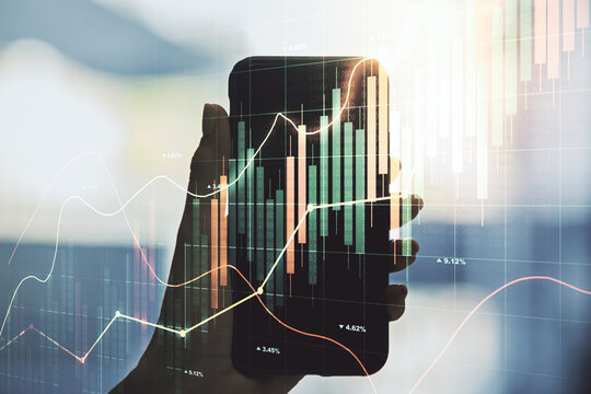 Multi exposure of abstract financial graph and hand with mobile phone on background, financial and trading concept