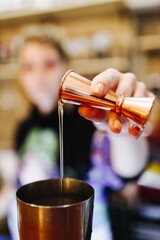 Fototapeta na wymiar bartender make a delicious cocktail