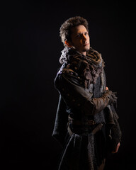 A guy in a steampunk or post-apocalyptic image, portrait on a black background