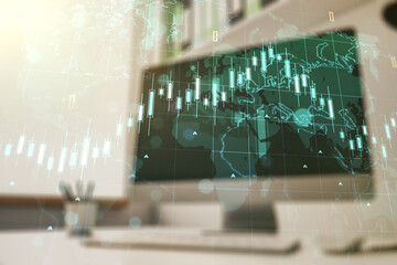 Multi exposure of abstract financial diagram with world map and modern desk with computer on background, banking and accounting concept