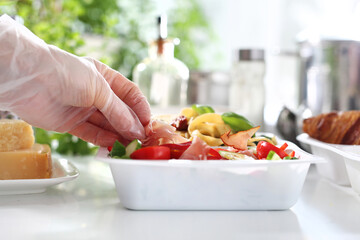  catering. pasta with zucchini, sun-dried tomatoes and spinach. Meal prep. Appetizing lunch boxes. Food delivered to your home