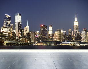 Empty concrete seafront on the background of a beautiful blurry Manhattan skyline at twilight, mockup
