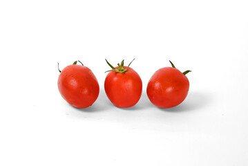 Many tomatoes on a white background