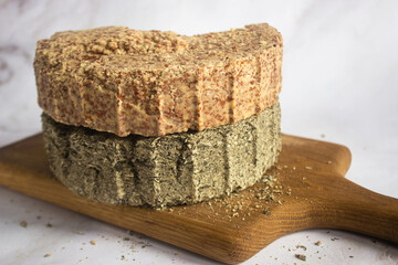 sunflower and almond cake on a wooden board