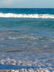 Ocean shore, powerful waves. A beautiful beach, a turquoise wave runs onto the shore. Natural marine background