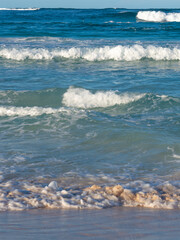 Ocean shore, powerful waves. A beautiful beach, a turquoise wave runs onto the shore. Natural marine background
