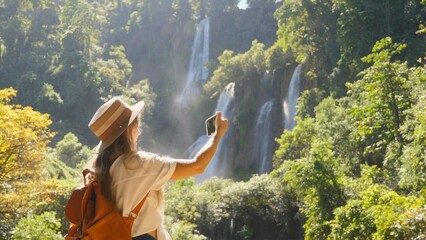 Modern social media content maker, influencer talk on video, shoot blog on mobile phone outdoors....