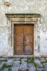 Fototapeta na wymiar Old rusty iron door of medieval castle