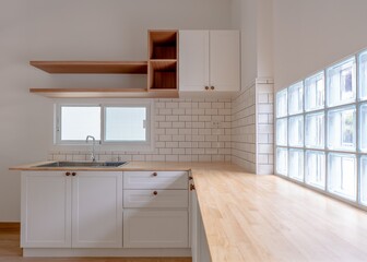 Kitchen in a house in white minimal style top counter with pine wood and teak wood door