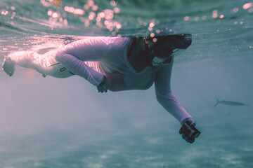 White Woman Tourist diving Red Sea underwater with the  Wild Sea Turtles near Marsa Alam, Egypt 