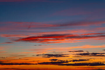 Orange and yellow cloudscape above the horizon