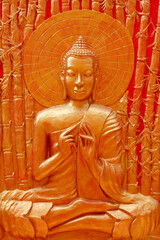 Detail of Buddha sculpture in Wat Ounalom : Buddha teaching to his disciples in Veluvana bamboo forest