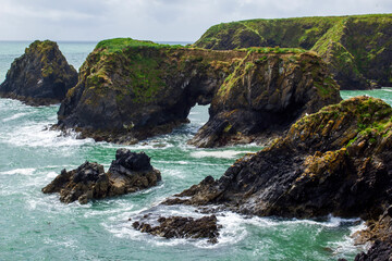Fototapeta na wymiar Picturesque cliffs and rock formations of Irish Sea