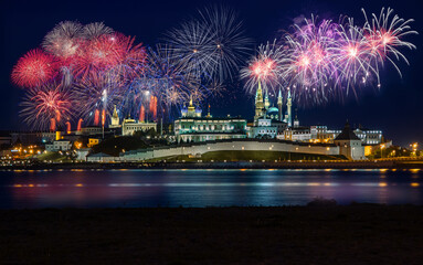 Fireworks over the Kazan Kremlin. View of the Kremlin from the bank of the Kazanka River. Holiday fireworks in Kazan