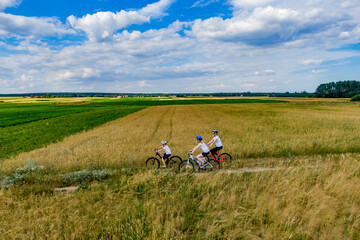 Obraz premium Active family biking. drone photo