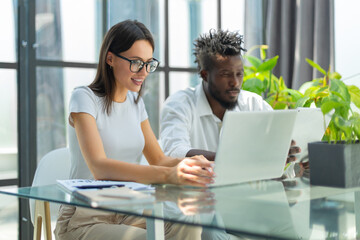 Young group of people doing their jobs on laptop