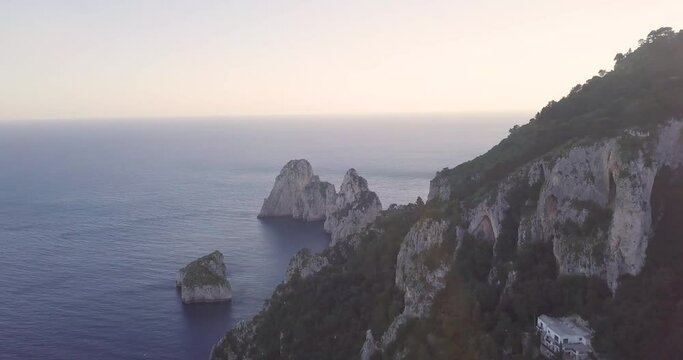Aerial view of the capri stones with a sun reflection