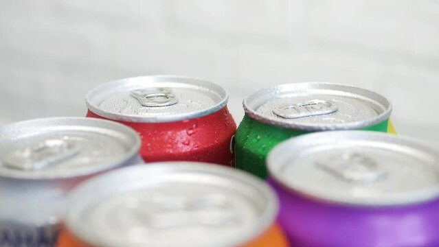 Various Cold, Sweet, and Carbonated Refreshing Drinks. Shooting with Refreshing Pop Can Drinks.