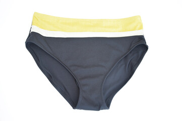 Black panties with a yellow stripe from a women's swimsuit, isolated on a white background....