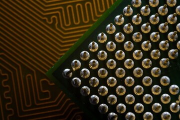 microprocessor on the background of the microcircuit of the motherboard