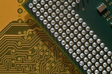 microprocessor on the background of the microcircuit of the motherboard.