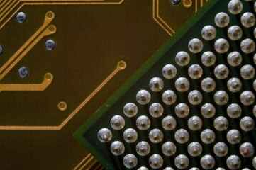 microprocessor on the background of the microcircuit of the motherboard.
