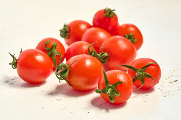 Cherry tomatoes, organic tomatoes on a light background