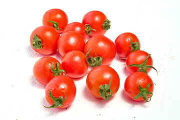 Cherry tomato group, organic tomatoes on a light background