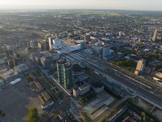 Utrecht skyline and central station public transport infrastructure and business district. Aerial drone overhead view. Tall buildings and towers downtown. Hoog Catharijne shopping center.
